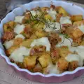 Patatas al horno con pechuga de pollo, pan rallado y mozzarella