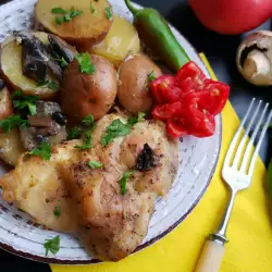 Pollo con champiñones y patatas al horno