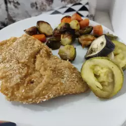 Schnitzel de pollo con verduras al horno