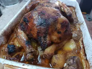 Pollo asado entero con patatas