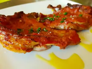 Chuletas de cerdo con vino y tomates