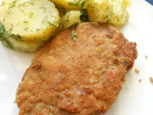 Schnitzels de carne picada con patatas al vapor