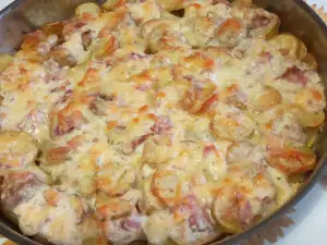 Patatas al horno con bacon y quesos