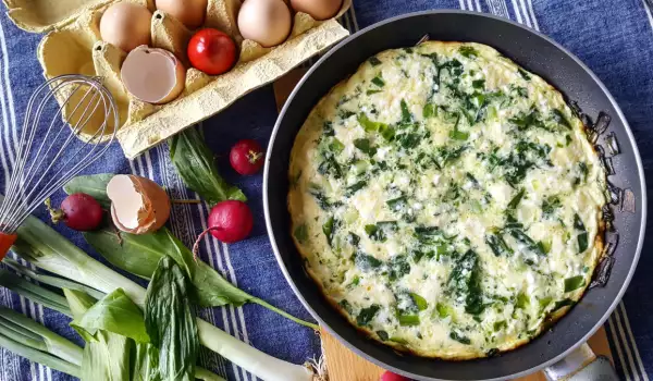 Tortilla de queso y verduras de hoja verde