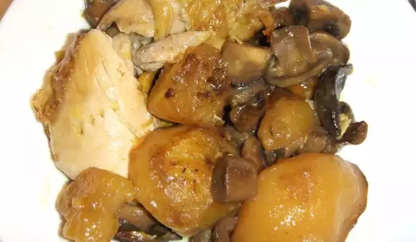 Pollo asado con champiñones, patatas y ajo