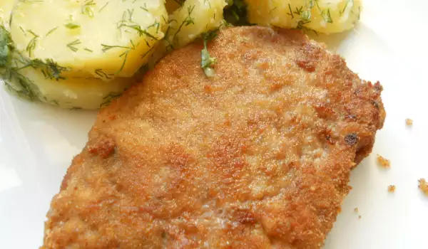 Schnitzels de carne picada con patatas al vapor