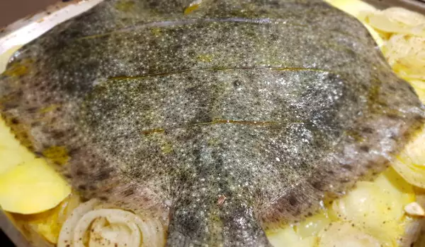 Rodaballo al horno con patatas y cebolla