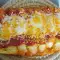 Canelones rellenos de alcachofas en salsa de tomate