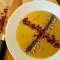 Crema de verduras con jamón y semillas