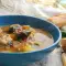 Guiso de albóndigas con patata y espinacas