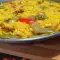 Paella de carne de pollo y conejo