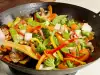 ¿Cómo cocinar en una sartén Wok?